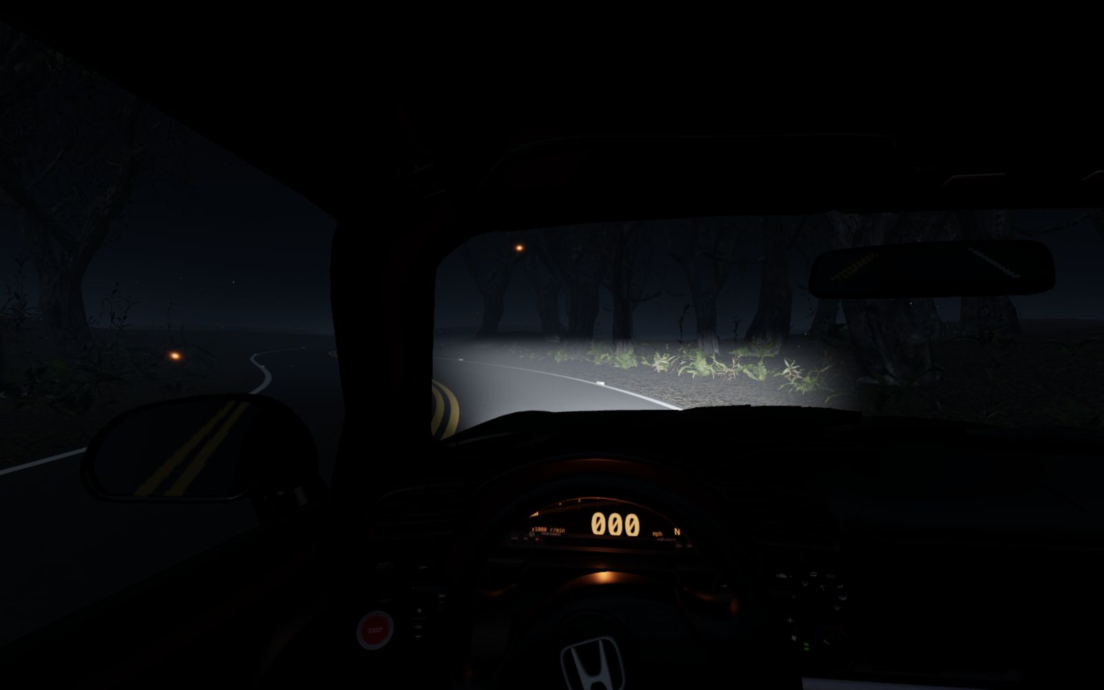Black Honda S2000 on a winding wooded road at night
